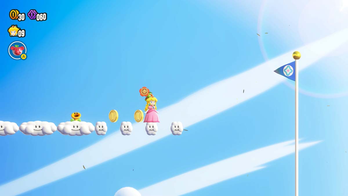 Princess Peach gracefully jumps towards the finish line flag against a clear blue sky