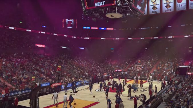 Wide-angle shot of a crowded basketball arena in NBA 2k24 with fans and players pre-game