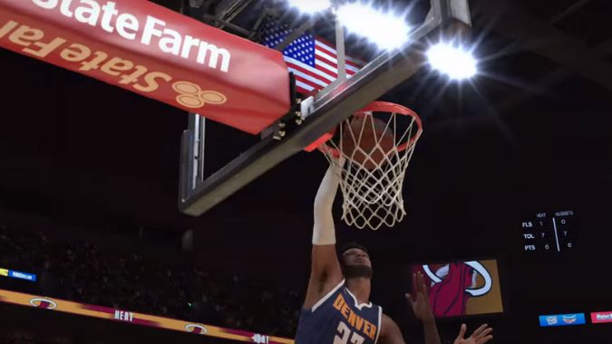 Action shot from NBA 2k24 of a player dunking the basketball during a game