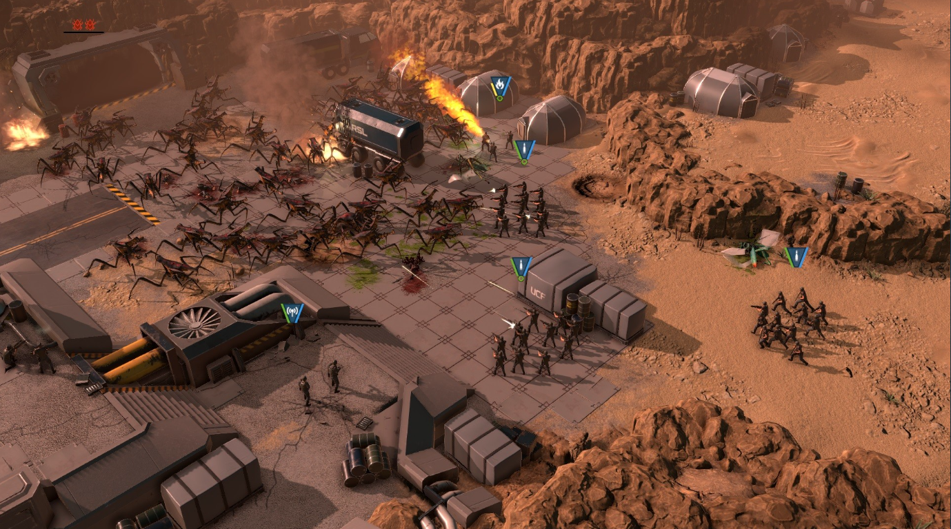 A screenshot from the game Starship Troopers: Terran Command showing humans fighting against arachnid aliens