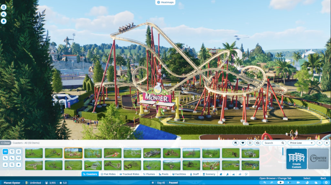 A screenshot from Planet Coaster 2 showing the build interface and a roller coaster in the background