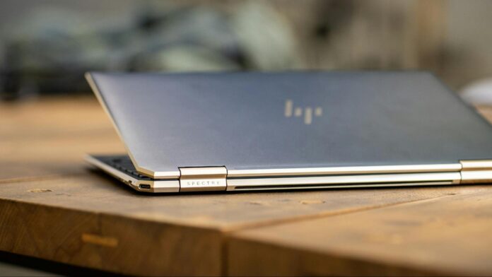 HP Laptop An HP laptop in soft focus on a table